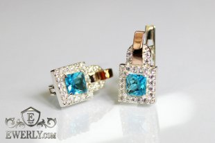 Серебряные серьги с золотыми вставками и светло-голубыми фианитами, фото